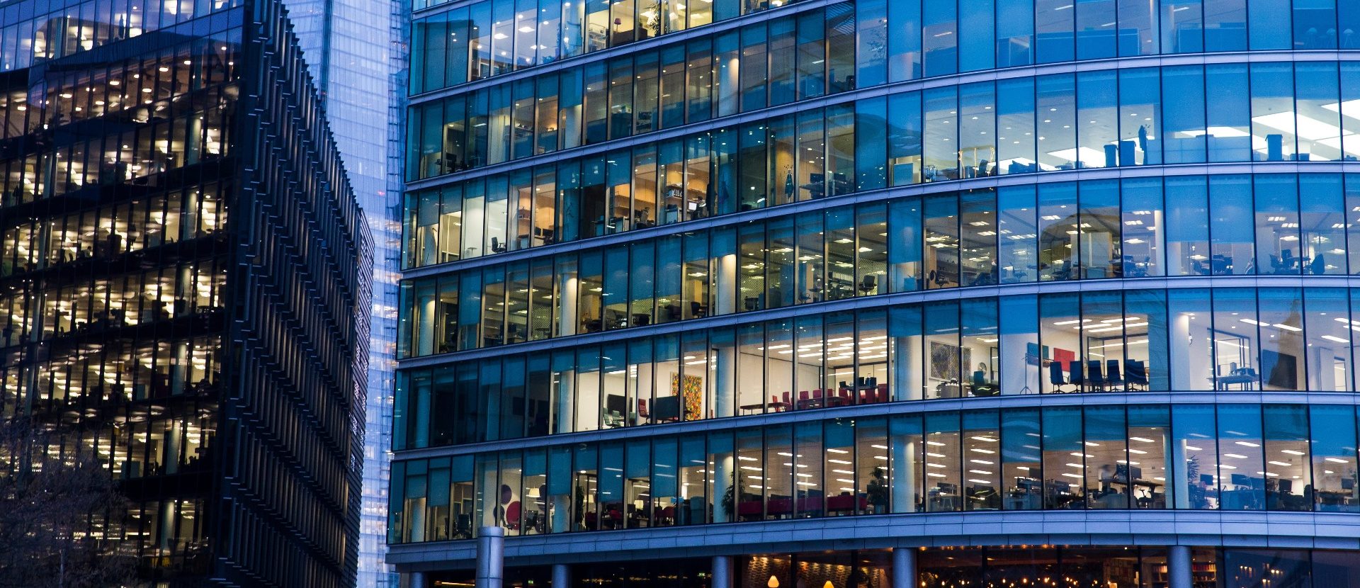 Modern commercial office building at dusk, Taurus Risk specialist commercial building insurance